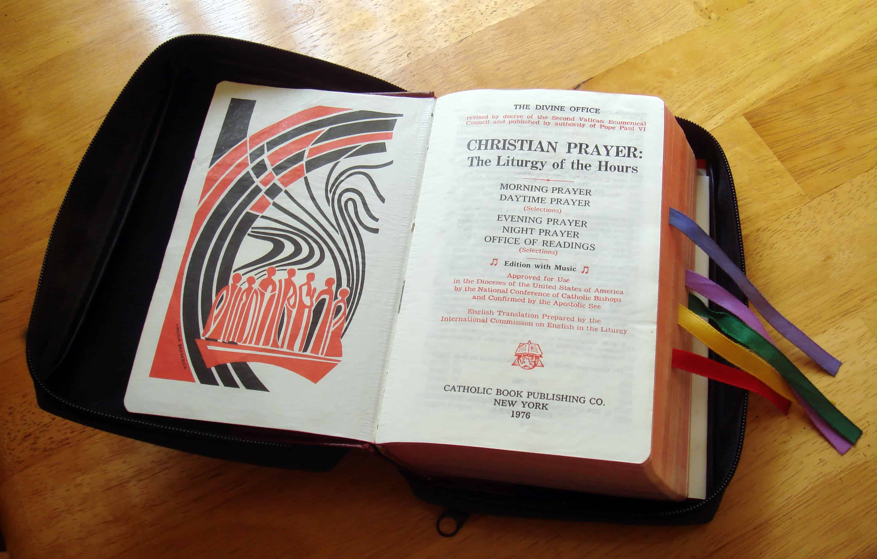 A person sitting by a window in soft morning light, holding an open breviary with a ribbon marker, hands resting calmly on the pages